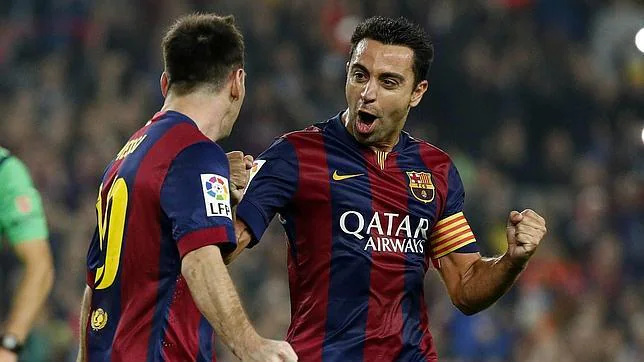Xavi y Messi, en un partido con el Barcelona