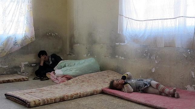 Una familia cristiana caldea refugiada en una habitación en Bagdad