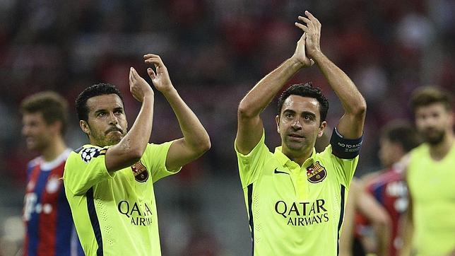 Xavi y Pedro celebran el pase a la final de la Champions League