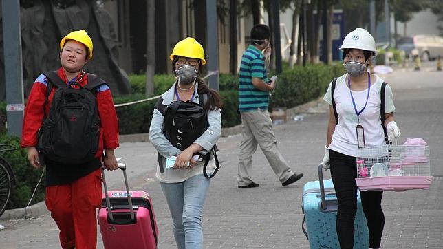 Ciudadanos de Tianjin se quejan de escozor en la piel tras primeras lluvias