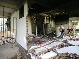 El detenido por el incendio de Las Naciones guardaba en su piso siete bombonas de gas y 120.000 euros