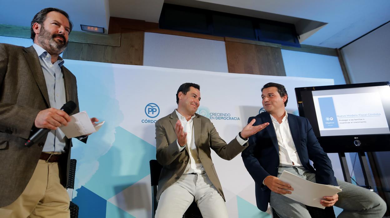 Adolfo Molina, Juanma Moreno y José María Bellido, en un acto del PP en Córdoba