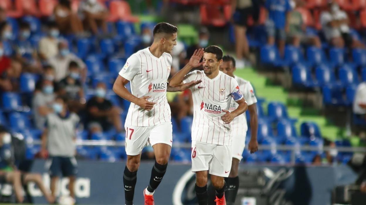 Lamela celebra con Navas su gol in extremis al Getafe