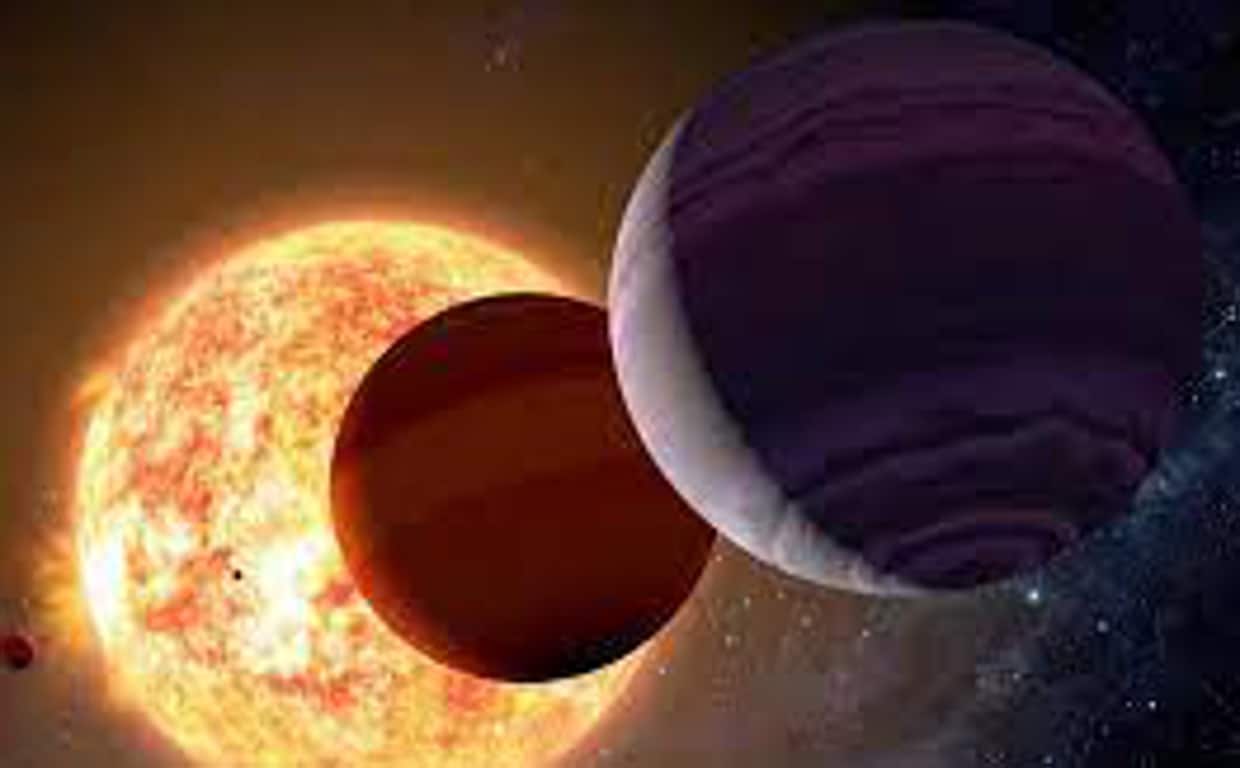 En la ilustración, una estrella rodeada de varios exoplanetas
