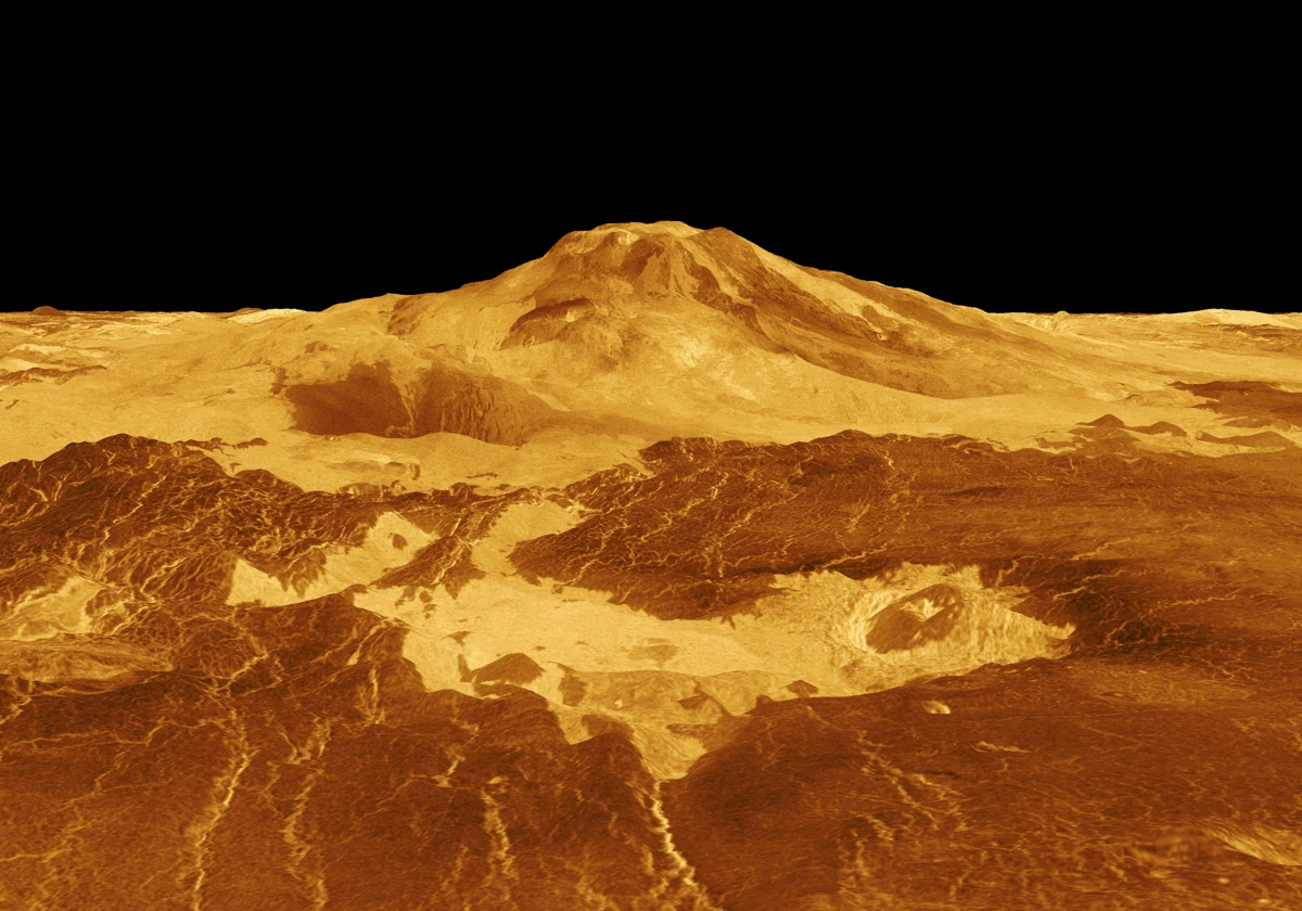 En la imagen, elaborada por ordenador con los datos del radar de apertura sintética de la sonda Magallanes, de la NASA, aparece el Monte Maat, en Venus. Los flujos de lava se extienden cientos de kilómetros a través de las llanuras fracturadas que se muestran en primer plano, hasta la base misma de la montaña