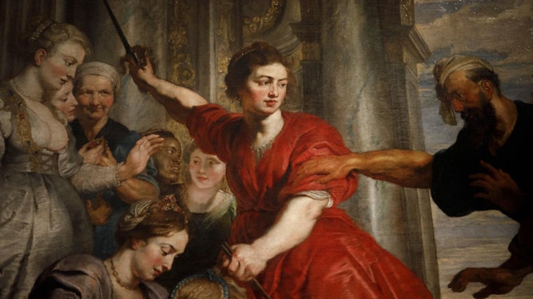 Van Dyck pintó a Aquiles disfrazado de mujer vestida de rojo en esta cuadro. Rubens, los dos hombres de la derecha