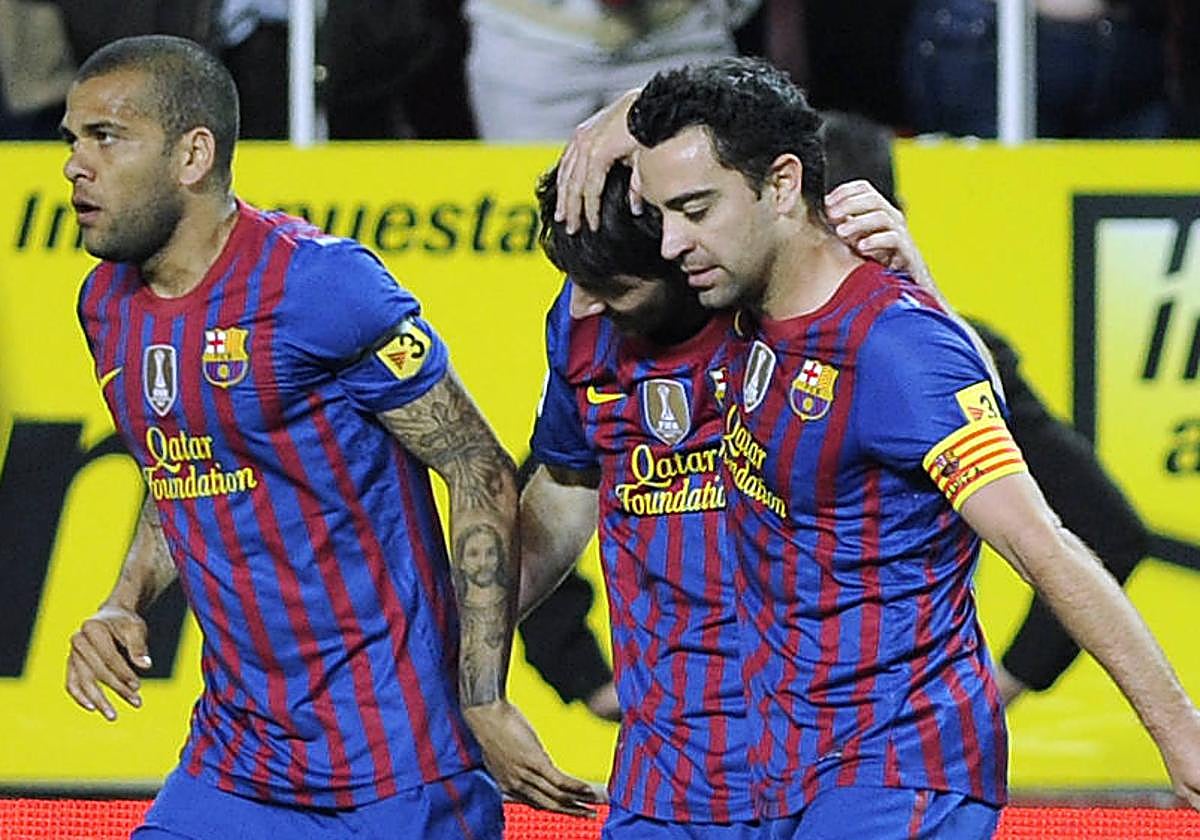 Dani Alves y Xavi, en su etapa como compañeros en el Barça