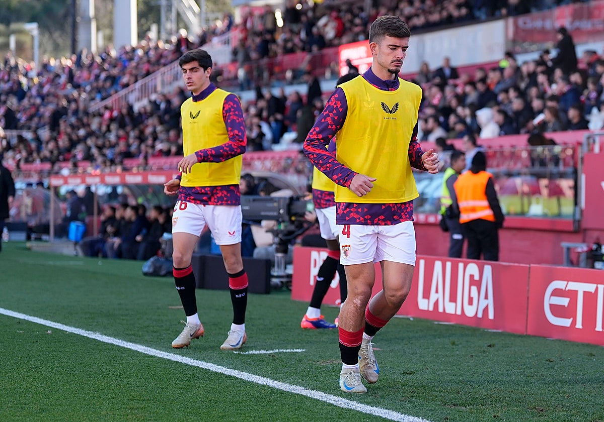 Juanlu y Kike Salas, calentando en Montilivi