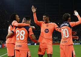 Los jugadores del Barça celebran el tercer gol