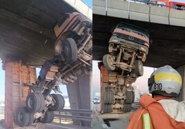 Un camión «se pone de pie» y queda atrapado en un puente tras perder su volquete en la A-3 de Valencia