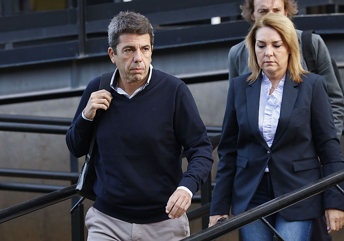 Imagen del presidente de la Generalitat Valenciana, Carlos Mazón, y la vicepresidenta, Susana Camarero, este lunes a su llegada al Cecopi
