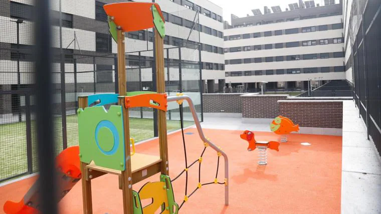 A playground inside the housing block where 28 squatter families reside