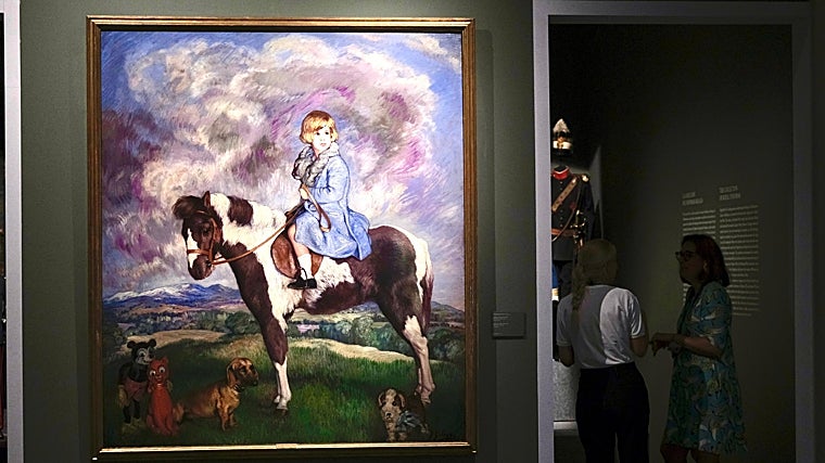 Cayetana de Alba retratada con 4 años, junto a un Mickey Mouse en la esquina inferior izquierda del cuadro