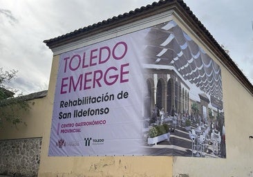 Dos grandes lonas del 'Toledo Emerge' anuncian el Centro Gastronómico y las viviendas para jóvenes de la Judería