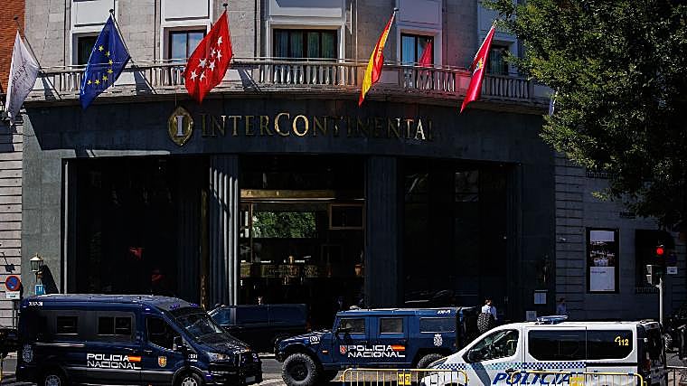 Several police cars monitor the surroundings of a hotel in Madrid