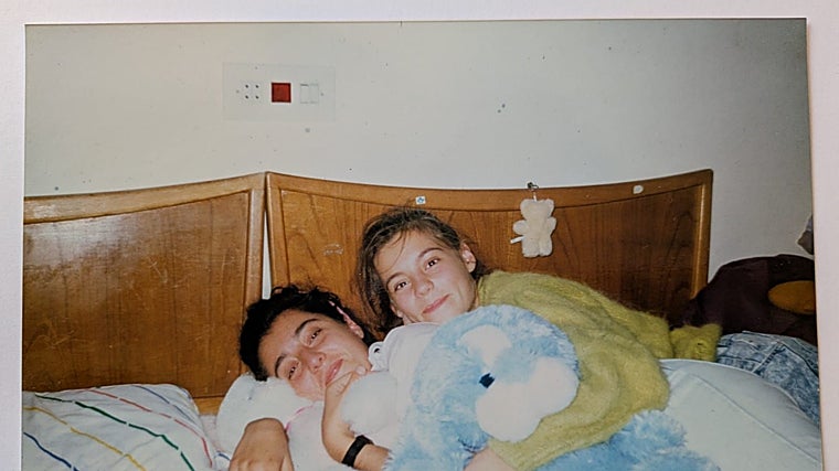 Ana, 16, kisses her sister Karina