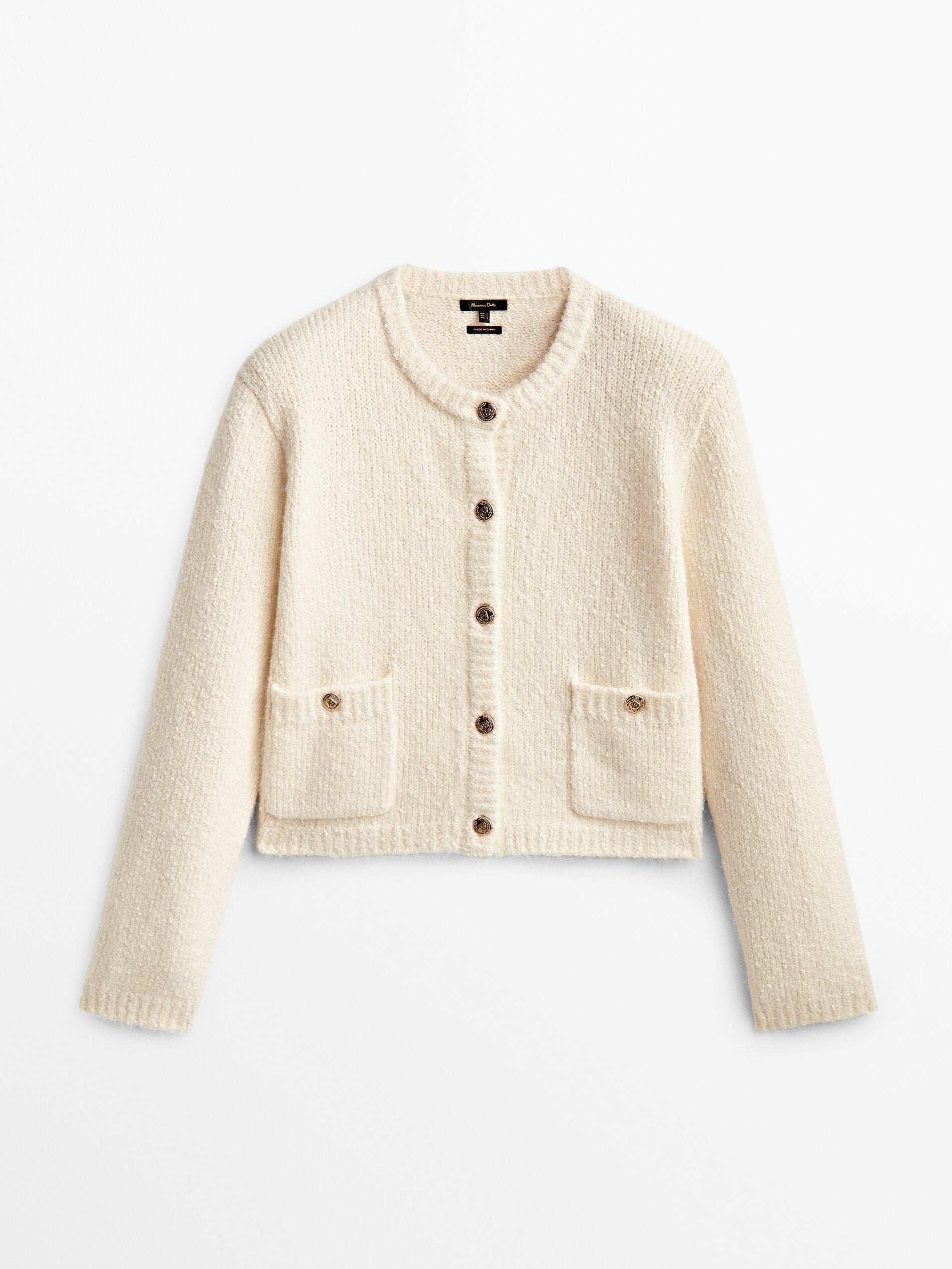 Cárdigan de punto con bolsillos y botones:  99,95 euros en Massimo Dutti.