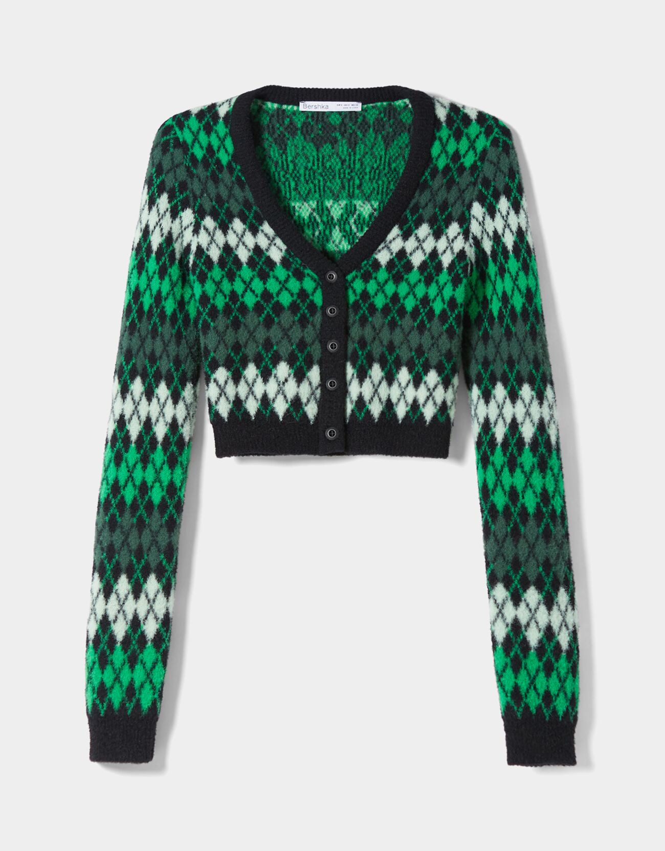 cárdigan de punto con rombos y botones: 22,99 euros en Bershka.