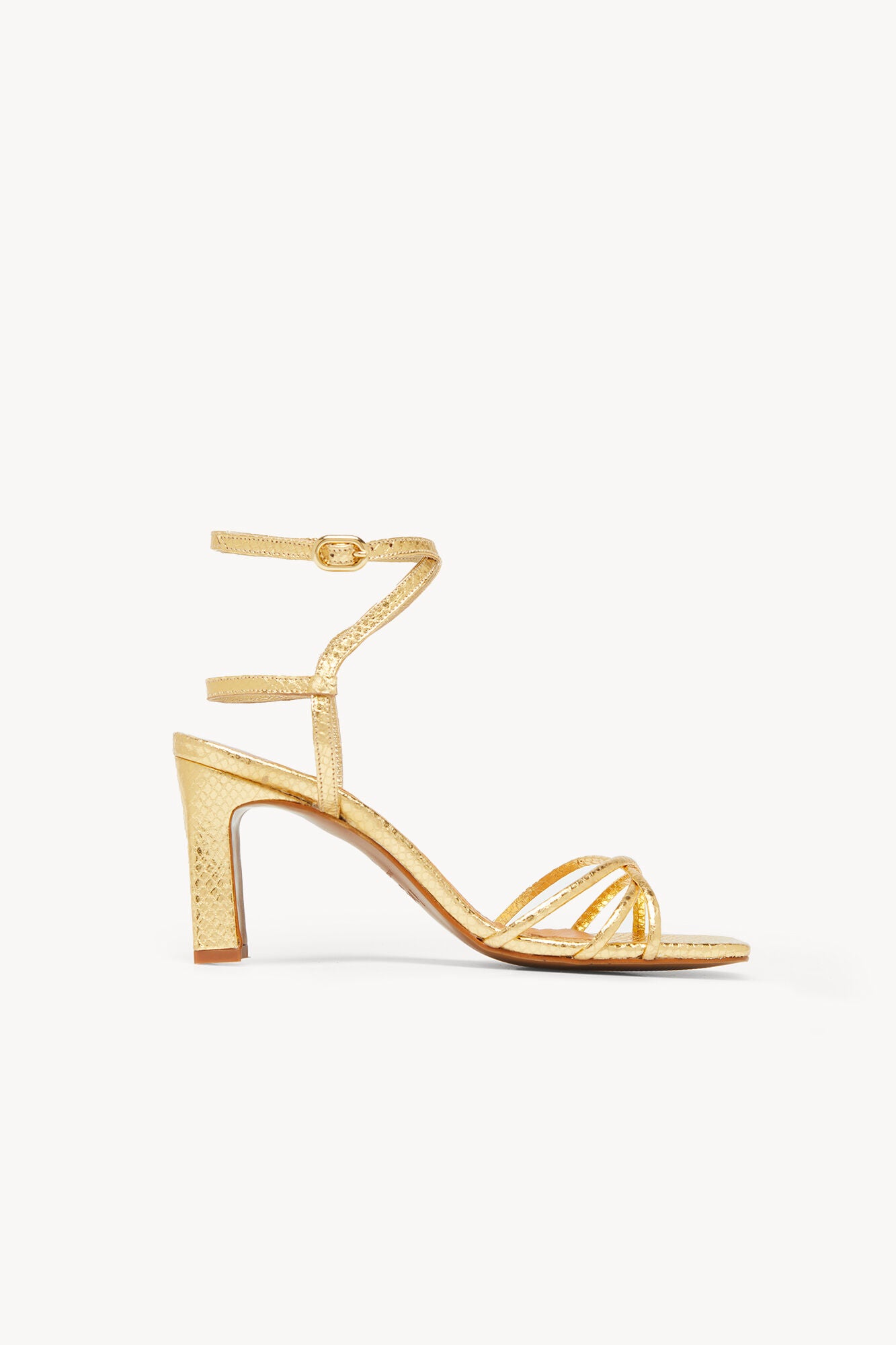 Sandalias de tacón en color dorado: 159 euros en Hoss Intropia.