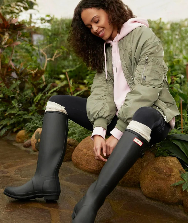 High socks are ideal to wear with wellies, such as those from the Hunter brand.