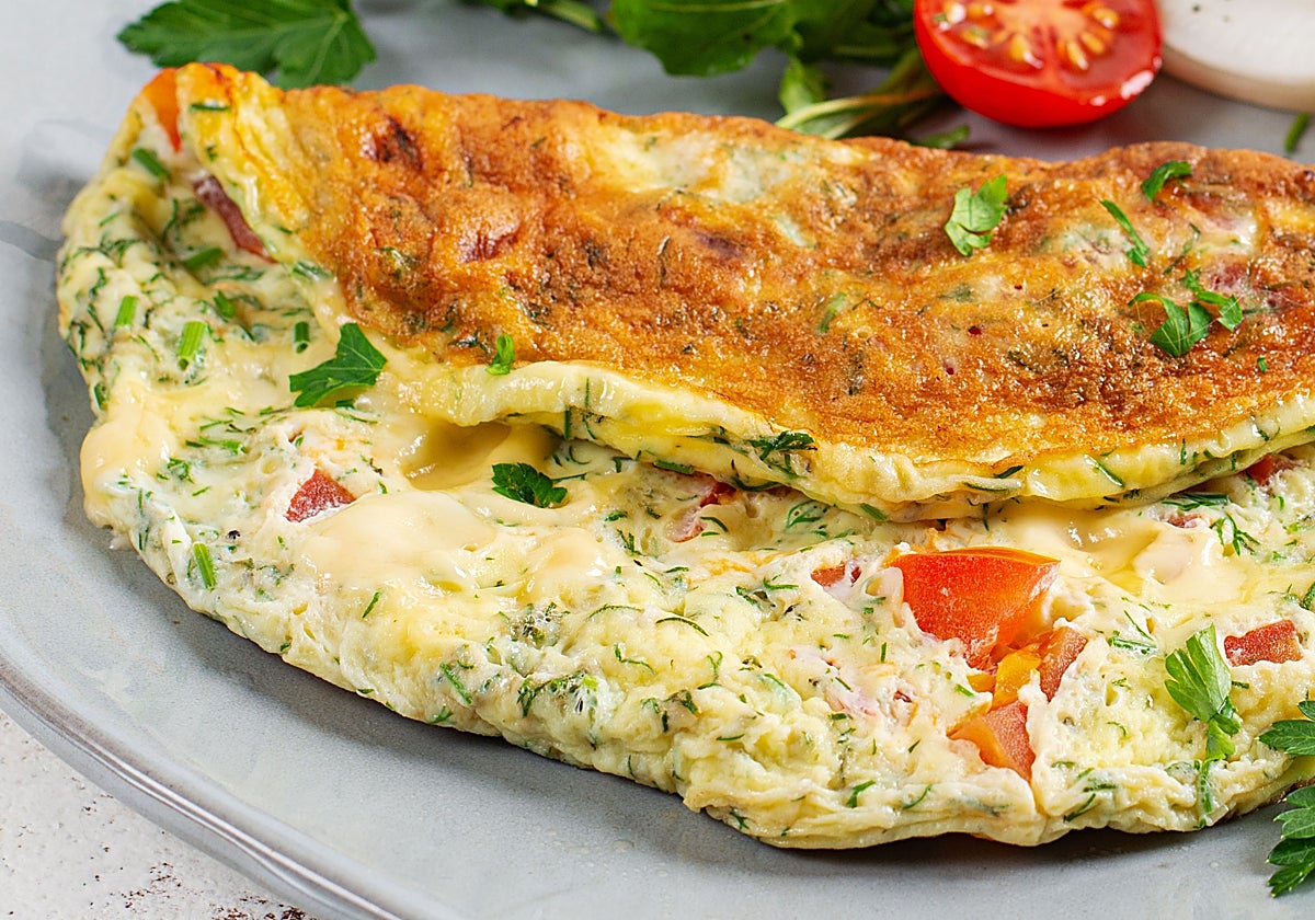 Tortilla rellena de tomate, queso, rúcula y jamón en pan integral