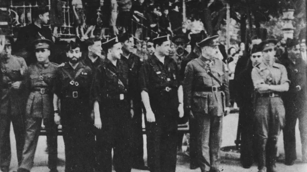 Manuel Hedilla (X) presiding over a parade in Burgos, shortly before his arrest.  To his right, the provincial chief José Andino