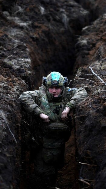 Ukrainian soldier in the trench of Bakhmut