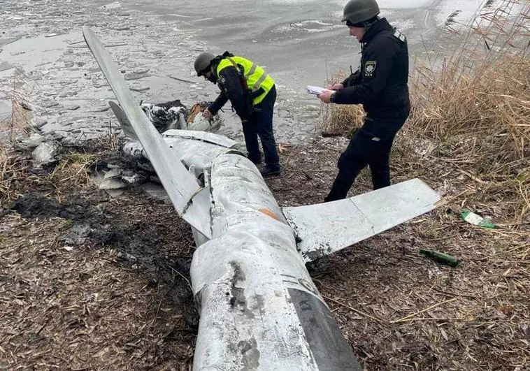Police officers inspect a Russian cruise missile that was shot down by the Ukrainian Air Defense Forces in the Kiev region on January 26.