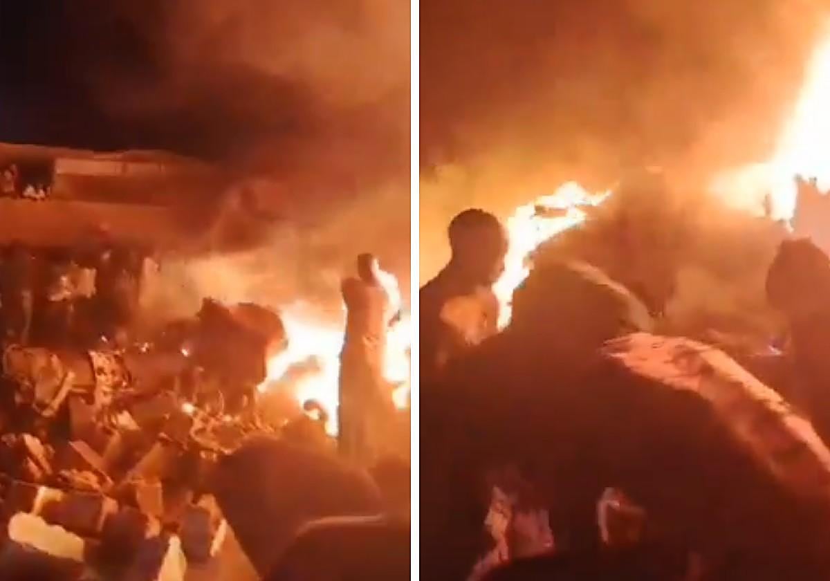 Varias personas intentando auxiliar a las víctimas del accidente de un avión militar