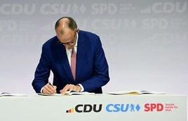 El conservador Merz firma con los socialdemócratas el acuerdo para una gran coalición en Alemania