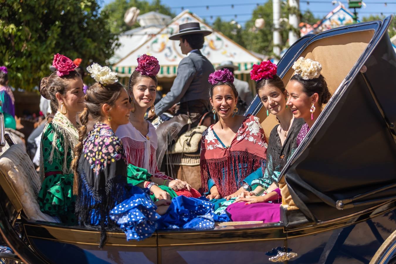Calor y multitudes este lunes en el real de la Feria