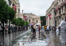 La lluvia desluce el día del Corpus en Sevilla
