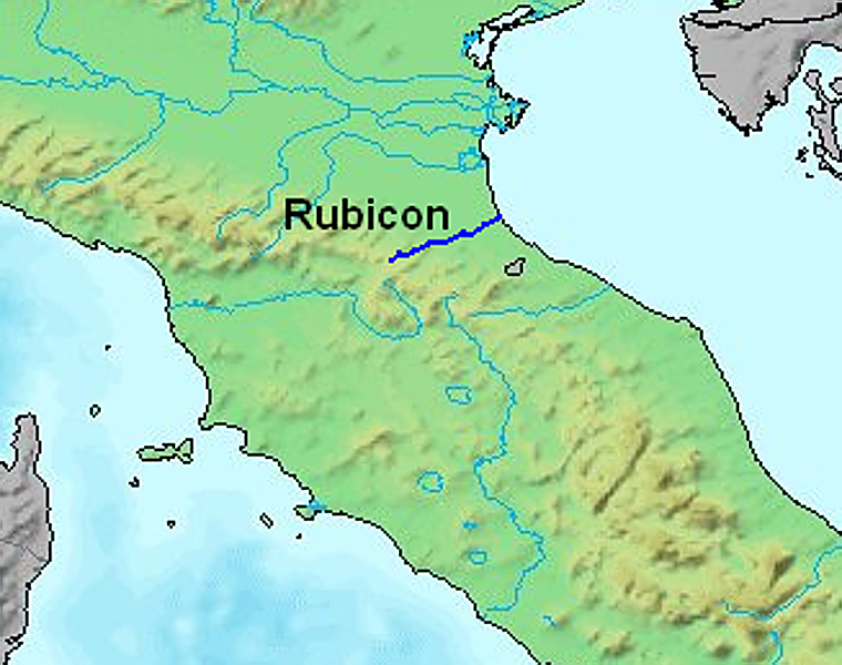 El río Rubicón, en el norte de Italia, marcaba la frontera entre la Galia Cisalpina, gobernada por César, y Italia, bajo la autoridad directa del Senado romano. Al cruzarlo con sus legiones en el 49 a. C., César desató la guerra civil y pronunció su célebre frase alea iacta est —«la suerte está echada»—