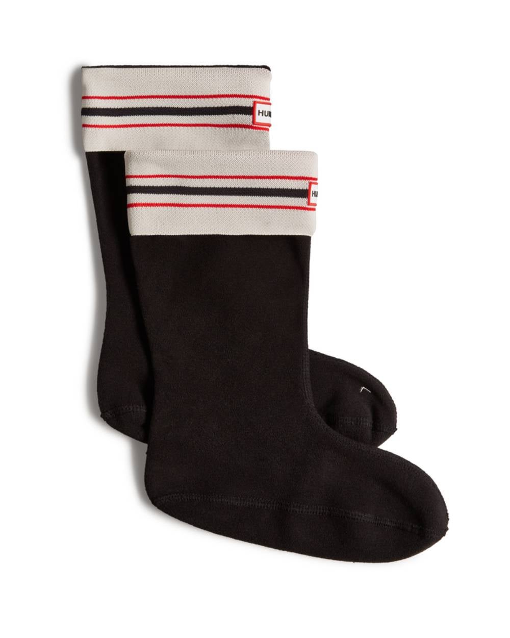 A la hora de protegerse de las bajas temperaturas todo importa. Incluso los calcetines, los cuales pueden ser además tan estilosos como estos de Hunter con rayas en la parte superior. Perfectos para llevarlos con botas. Precio: 30 euros. 