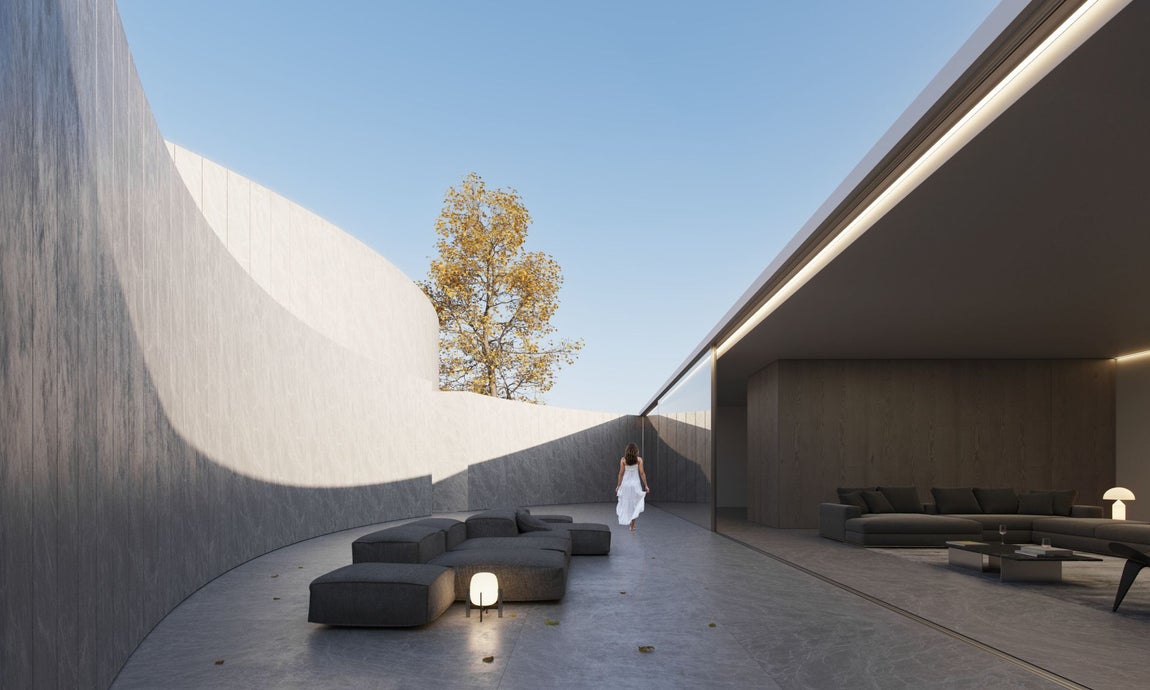 Desde la cota más alta de la parcela, se accede a un patio caracterizado por una lámina de agua que crea un espacio agradable para disfrutar en varios momentos del día. Desde este espacio, una escalera exterior conduce al patio del círculo que alberga las habitaciones y un hall interior con vistas al mar.