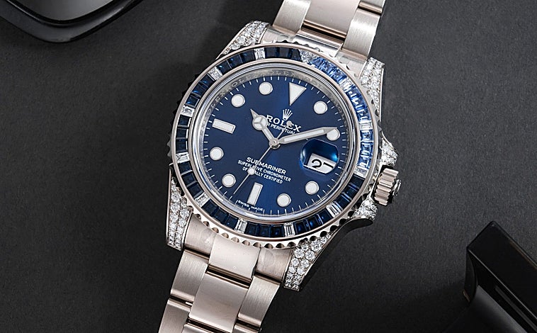 A imagem principal é do Rolex Submariner e Rolex Daytona 116578SACO em leilão.