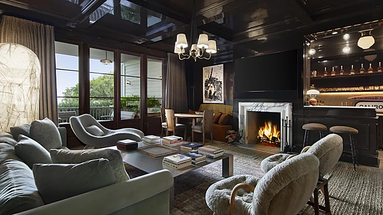 One of the lounges with bar and fireplace