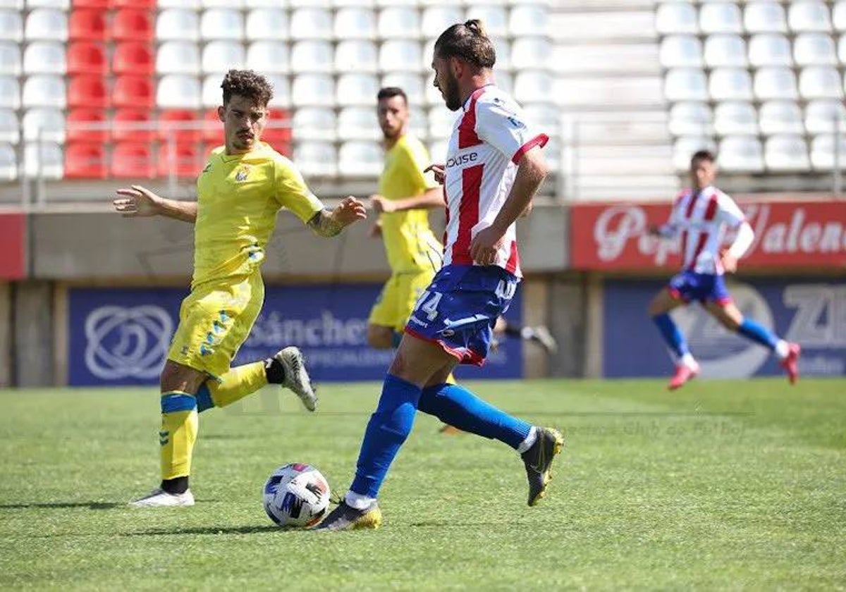 Diego Guti, a la izquierda, con el primer equipo de Las Palmas