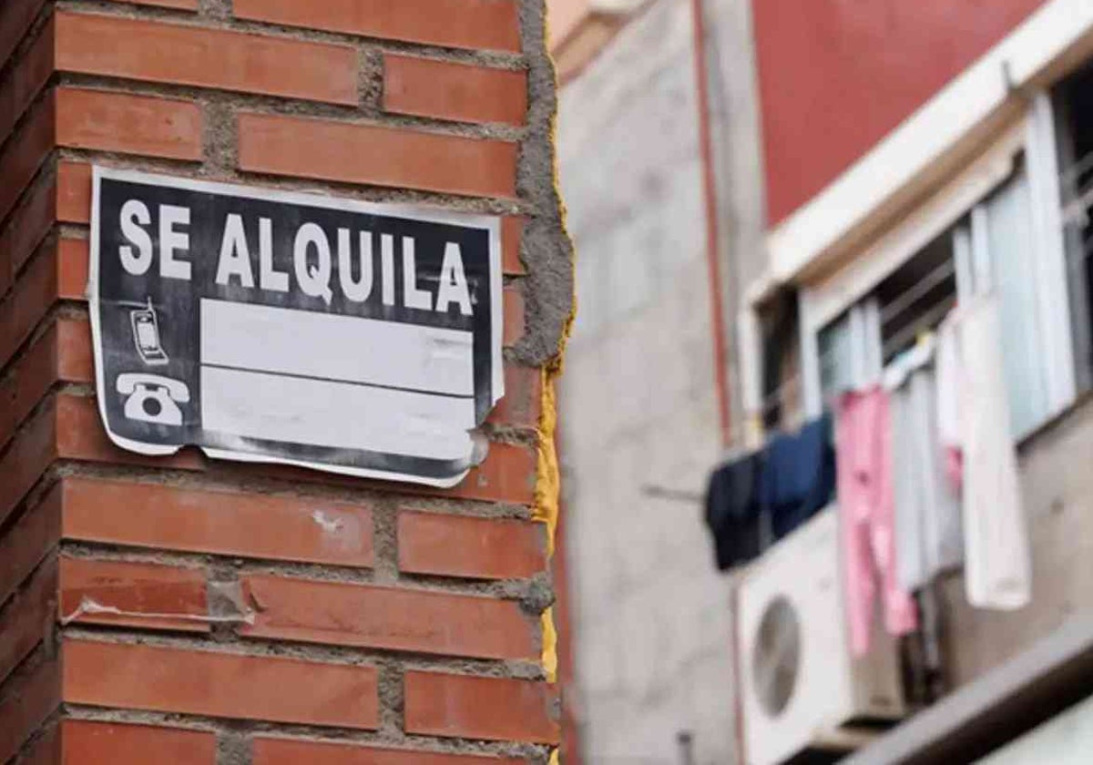 Cartel de alquiler un edificio de viviendas