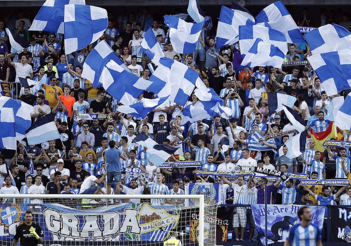 Aficionados del Málaga durante un encuentro en La Rosaleda