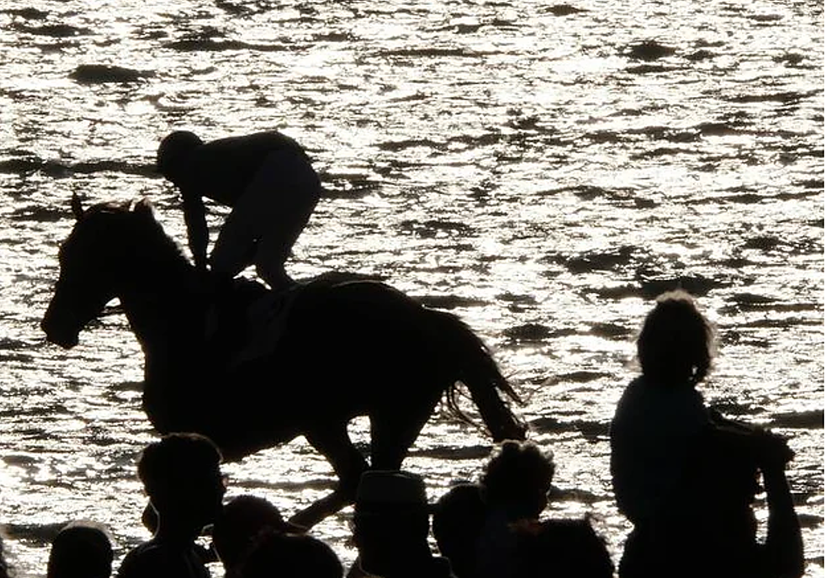 Un momento de las carreras en la playa de Sanlúcar