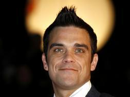Robbie Williams volverá a Take That para escribir la biografía del grupo