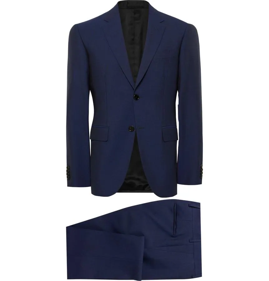 Traje de Berluti. En azul marino debes tener el clásico traje en el armario perfecto para cualquier ocasión. Este de lana y mohair es elegante y de lo más favorecedor (Precio: 3600 euros).