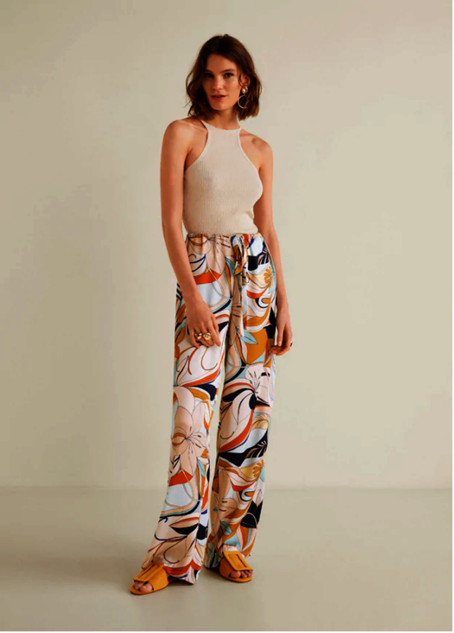 Pantalones satinados. Este tipo de pantalones son ideales tanto para la mañana como para la noche, permiten crean variedad de vestuarios en los dias calurosos. El gran punto de este tejido es lo mucho que puede llegar a vestir con unos buenos accesorios. Mango