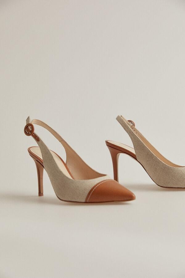 Pedro del Hierro - Los imprescindibles para la vuelta a la ciudad. Stilettos destalonados de napa y tejido, de Pedro del Hierro. Un modelo con el tacón medianamente bajo para recorrerse la ciudad sin renunciar a la comodidad. Precio: 189€.