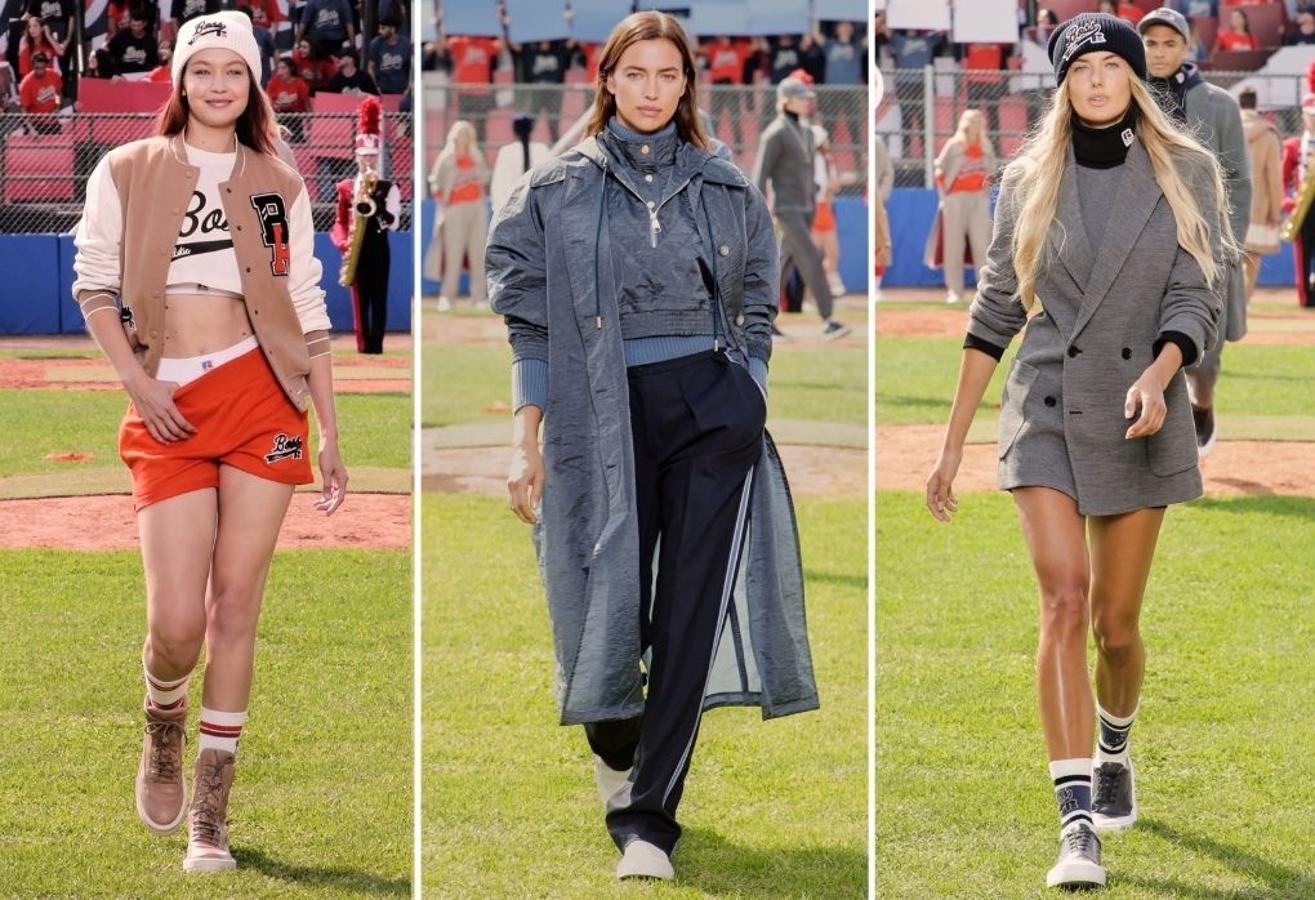 Hugo Boss - MFW primavera-verano 2022. El Kennedy Sport Center de Milán se ha transformado en un campo de béisbol al más puro estilo americano en un ‘partido’ donde no han faltado todo tipo de personalidades del mundo del cine y la moda. Un desfile en el que se han visto rostros como Gigi Hadid o Irina Shayk y en el que el hilo conductor de la propuesta ha sido el ‘athleisure’ de la década de los noventa. Se han visto además de las piezas propiamente deportivas, otras opciones en donde la sastrería se ha reinterpretado siempre con ese mismo espíritu.