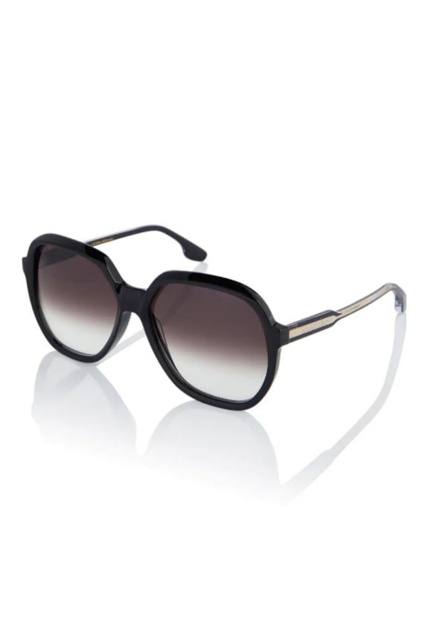 Victoria Beckham - Accesorios originales para los looks Navideños. Gafas de sol redondas con cristales degradados y detalles metalizados, de Victoria Beckham. Precio: 270€.