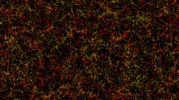 Este es uno de los sectores del mapa de la estructura a gran escala del Universo. Cada punto indidica la posición de una galaxia 6 mil millones de años en el pasado. La imagen cubre aproximadamente 1/20 del cielo. El color indica la distancia de la Tierra, amarillo para las galaxas más cercanas y violeta para las más alejadas. Las galaxias aparecen muy agrupadas, revelando supercúmulos y enormes vacíos cuya existencia se "sembró" en la primera fracción de segundo tras el Big Bang. Esta imagen contiene 48,741 galaxias, alrededor del 3% del conjunto de datos completo del mapa, que incñuye 1.200.000 galaxias