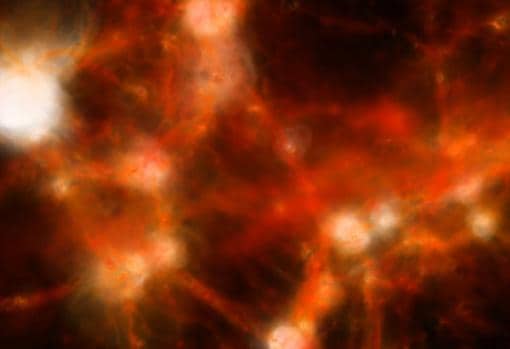 Simulación por ordenador para la evolución del Universo. En rojo, filamentos de materia oscura. En los puntos donde interaccionan varios se acumuló materia convencional (bariónica) y se formaron galaxias. En estos filamentos, no visibles, hay gas intergaláctico caliente en la actualidad