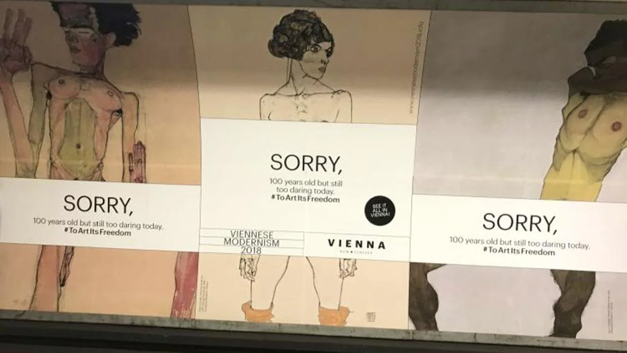 Estación de metro londinense con el anuncio de la exposición censurado
